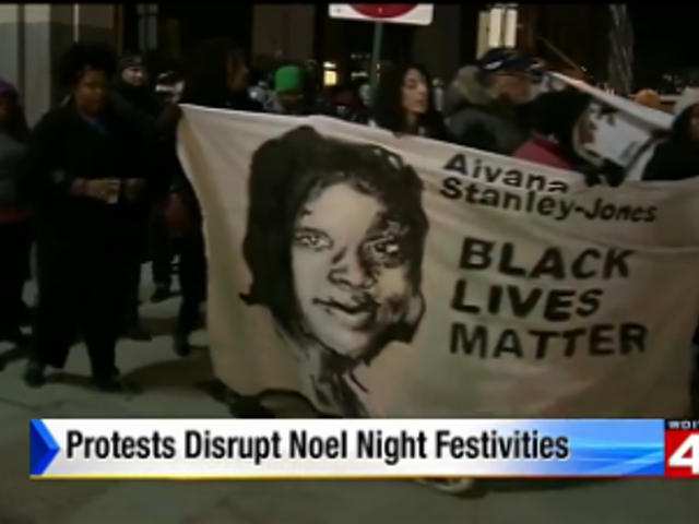 By the way, big ups to WDIV newscaster Priya Mann for declaring that "there were no arrests; this was a very peaceful protest," despite WDIV's caption implying otherwise.