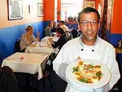 L.A. Express' owner-chef, Michael Chamas, serves chicken lasagna.