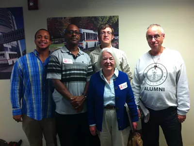 A group of metro Detroit residents wearing “Bring Back the Buses” stickers attended a meeting of the Suburban Mobility Authority for Regional Transportation’s board of directors on Sept. 25, 2014, to ask for more frequent service along Woodward Avenue.