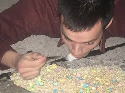 Image: Michigan man fills pothole with Lucky Charms, eats it