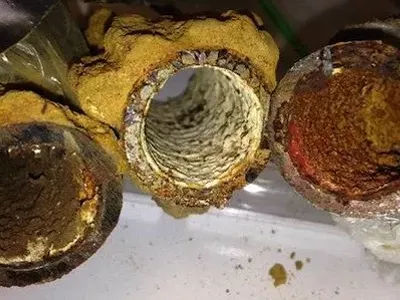 Photo of Flint drinking water pipes showing different kinds of iron corrosion and rust.