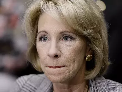 This person claims to run the Department of Education, but some say she's a puppet for the NRA.