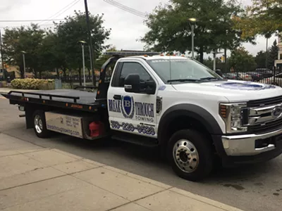 A Breakthrough Towing driver idles on East Canfield, waiting for his next victim.