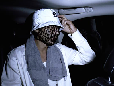 A brilliant mind lurks behind the disguise.