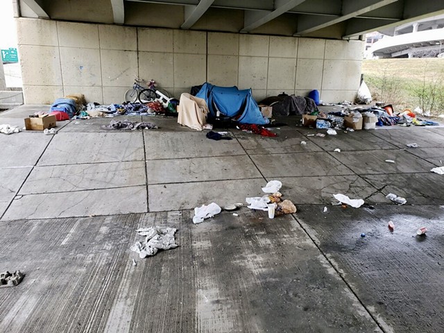 A makeshift homeless camp under an overpass by Joe Louis Arena before police seized the belongings.