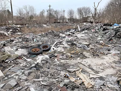 An illegal junkyard built by a Macomb County man in the North End neighborhood.