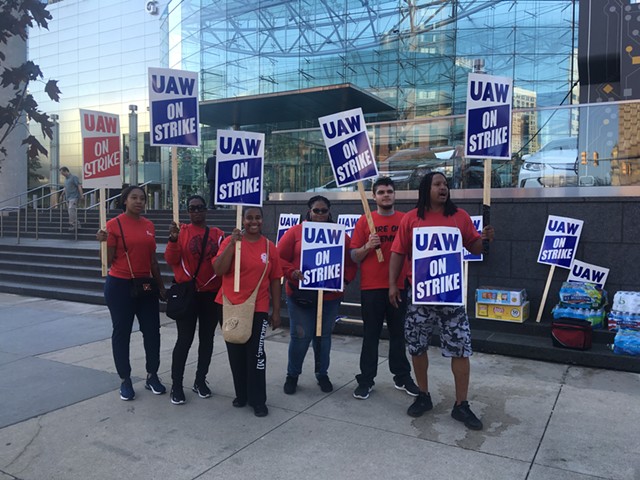 Workers on strike outside of GM's Detroit headquarters.