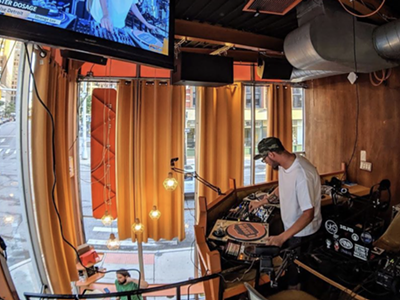 A DJ spins during a past edition of Urban Bean Co.'s "Planet Funk" show.