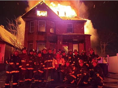 Image: Detroit firefighters may face discipline after posing in front of burning house