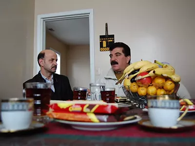 Samir Alrashdan, right, and landlord Bashar Imam in Hamtramck.