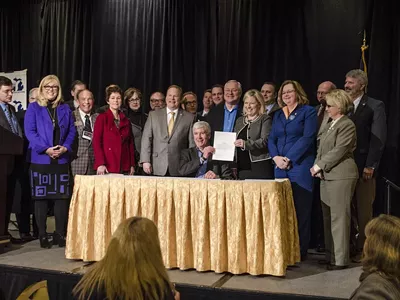 'A motley assortment of Grand Rapids-area legislators resembling a rural PTA.' (Click to see larger version.)