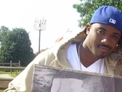 Ray-J holding a picture of Ray-J