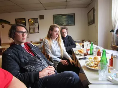 Ryan (far left) and Fabia (center) Mendoza settle in for fish and chips at Scotty Simpson's.