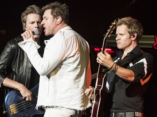 Duran Duran's John Taylor, left, Simon Le Bon, and Dom Brown onstage at DTE Energy Music Theatre on Monday.