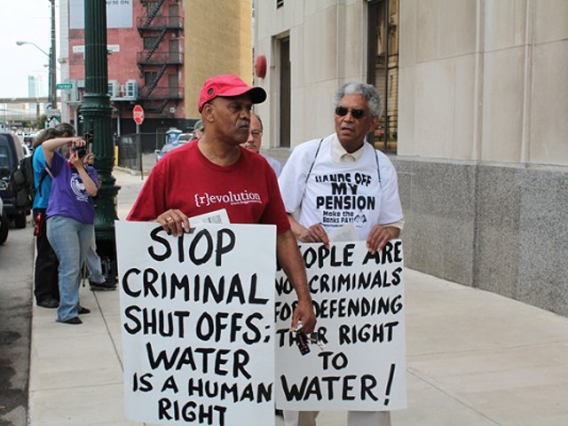 A coalition of welfare rights groups rally outside of the Detroit Water & Sewerage Department's main office at 735 W. Randolph in downtown Detroit on Friday, June 6.