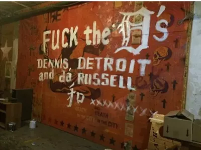 Anti-Dennis Kefallinos graffiti scrawled across a mural at the Russell Industrial Center