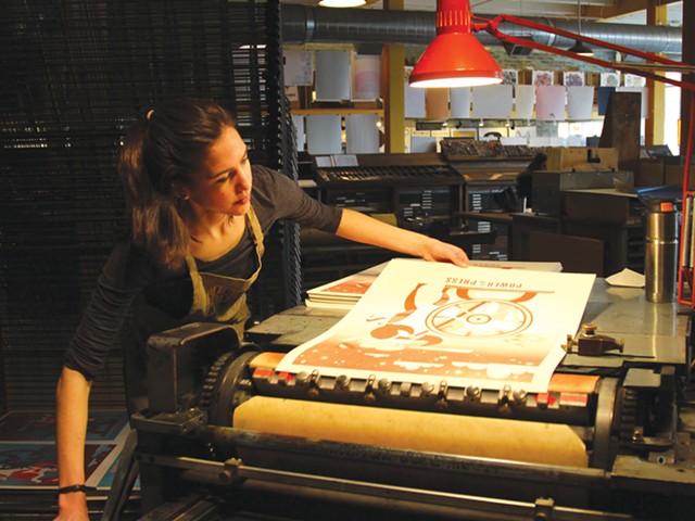 Sophia Pappas prints her poster for Power of the Press Fest at Eastern Market’s Signal-Return.