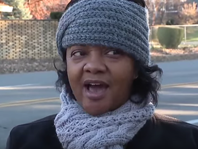 Monica Conyers addresses reporters outside the home she shares with Congressman John Conyers.