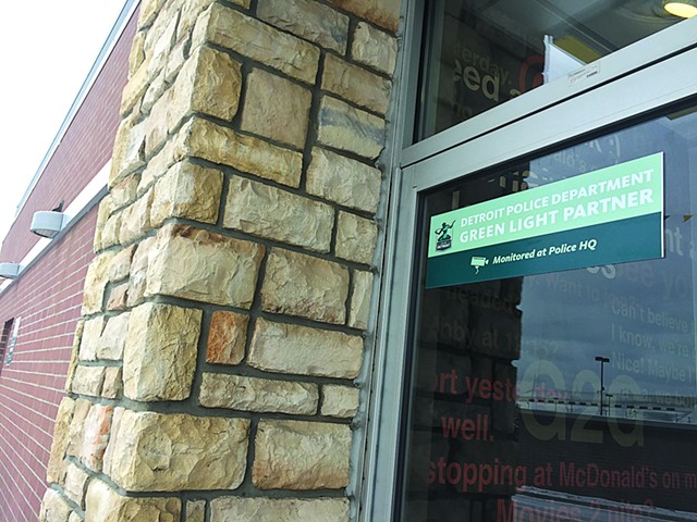 Project Green Light signage at a McDonald’s on Eight Mile in Detroit. More than 230 businesses have invested thousands of dollars in the real-time surveillance program by Detroit police.