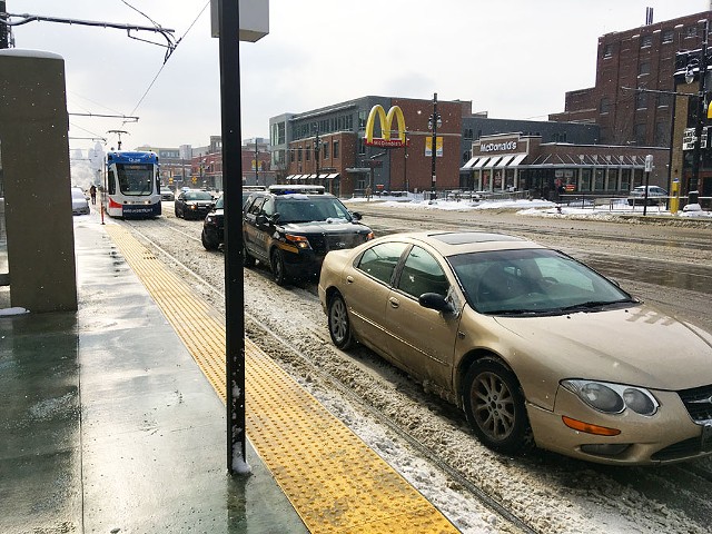 A reminder to please not park on the QLine tracks