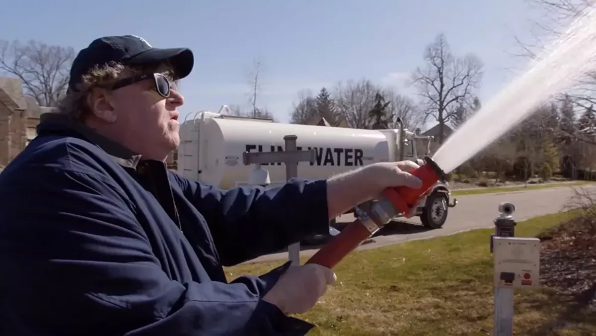 Image: The cold, hard truth: Michael Moore delivers Gov. Rick Snyder a surprise in Fahrenheit 11/9.