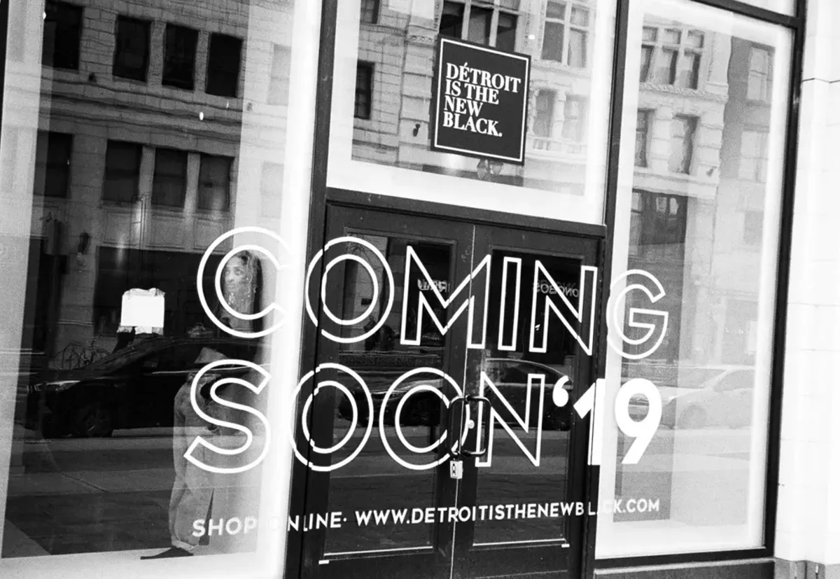 Image: Roslyn Karamoko in the window of her soon-to-open Détroit Is the New Black store downtown.