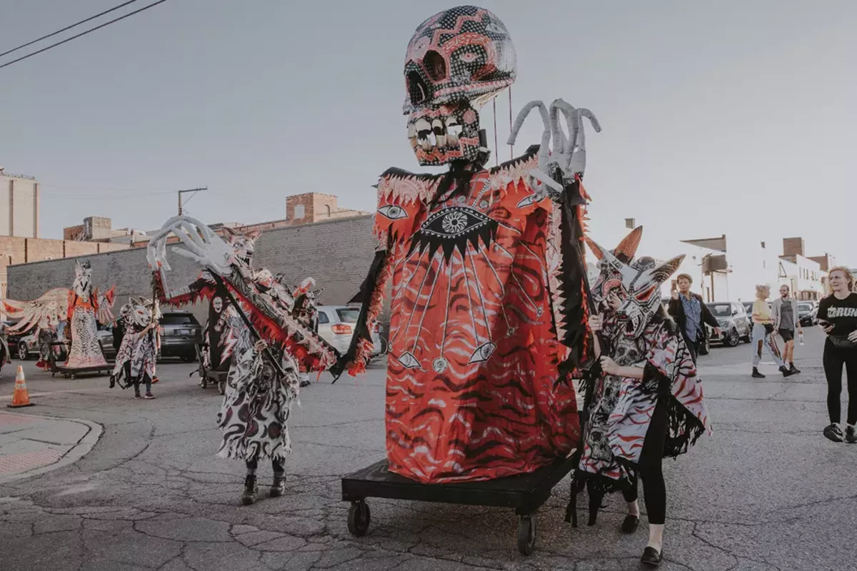 Image: A procession of works by Dennis McNett at the Murals in the Market festival. The festival has grown to include three-dimensional works in recent years.