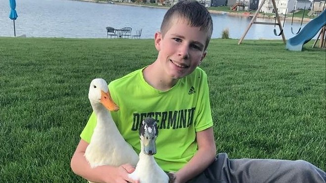 Dylan with his emotional support ducks, Nibbles and Bill.