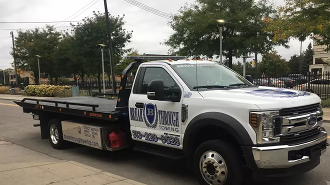 A Breakthrough Towing driver idles on East Canfield, waiting for his next victim.