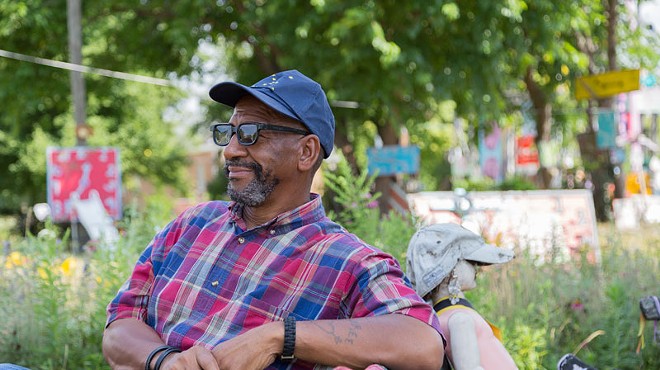 Tyree Guyton at his creation, the Heidelberg Project.