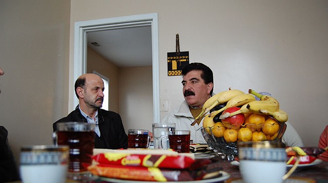 Samir Alrashdan, right, and landlord Bashar Imam in Hamtramck.