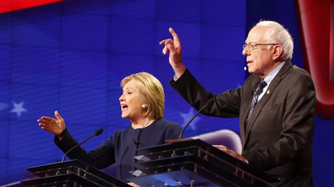 Former Secretary of State Hillary Clinton, left, and Vermont Sen. Bernie Sanders during Sunday's Democratic presidential debate at The Whiting Auditorium in Flint.