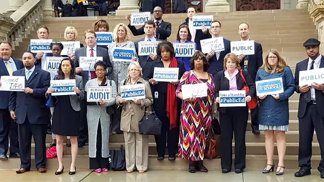 Michigan representatives who want an audit of DPS stand on the steps of the state Capitol.