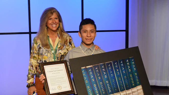 Pictures of Hope founder Linda Solomon with 13-year-old Cesar Chavez MIddle School student Cristian Luz-Gutierrez during a reception Thursday at WXYZ-TV.