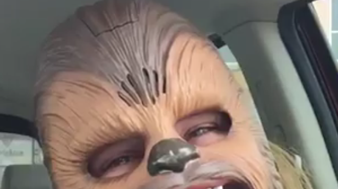 This lady wearing a Chewbacca mask will make your day