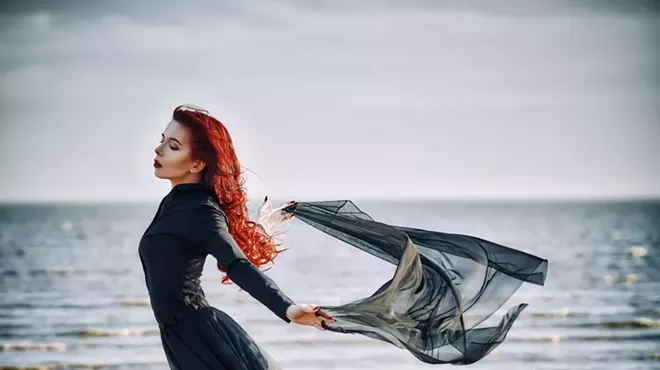 This is how goth people spend their time at the beach. We assume.