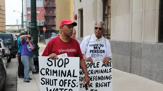 A coalition of welfare rights groups rally outside of the Detroit Water & Sewerage Department's main office at 735 W. Randolph in downtown Detroit on Friday, June 6.