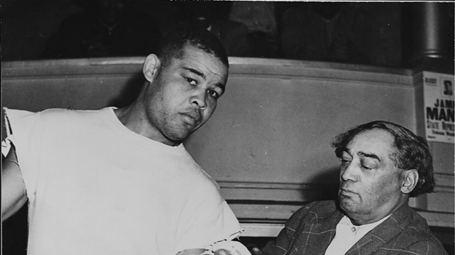 Joe Louis, left, and the intriguing Henry Johnson, right. Referred to in Maraniss' account as "Pappa Dee," a driver, Johnson was a hustler in the black community who ran a barbershop and "managed" boxers.