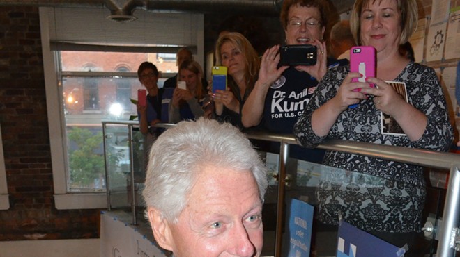 Former President Bill Clinton arrives at a campaign office in downtown Pontiac Monday.