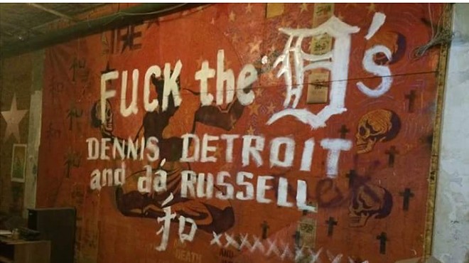 Anti-Dennis Kefallinos graffiti scrawled across a mural at the Russell Industrial Center