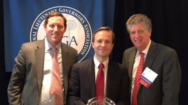 Lt. Gov. Brian Calley poses with public health award from the National Lieutenant Governors Association.