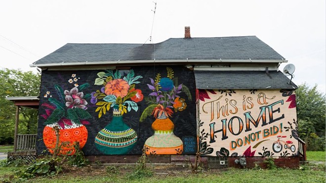 A message painted on a foreclosed Detroit home aims to make it easier for the family inside to buy it at auction.