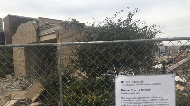 Scathing sign lampoons DIA's Barat House demolition