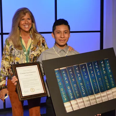 Pictures of Hope founder Linda Solomon with 13-year-old Cesar Chavez MIddle School student Cristian Luz-Gutierrez during a reception Thursday at WXYZ-TV.