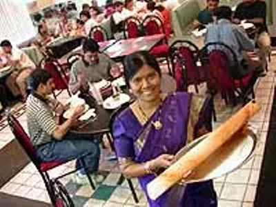 Udipi: Thilagam Pandian serves dosa (Indian crepe)