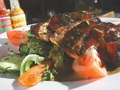 Voodoo chicken salad: Blackened chicken breast smothered with New Orleans-style BBQ sauce over hot vegetables.