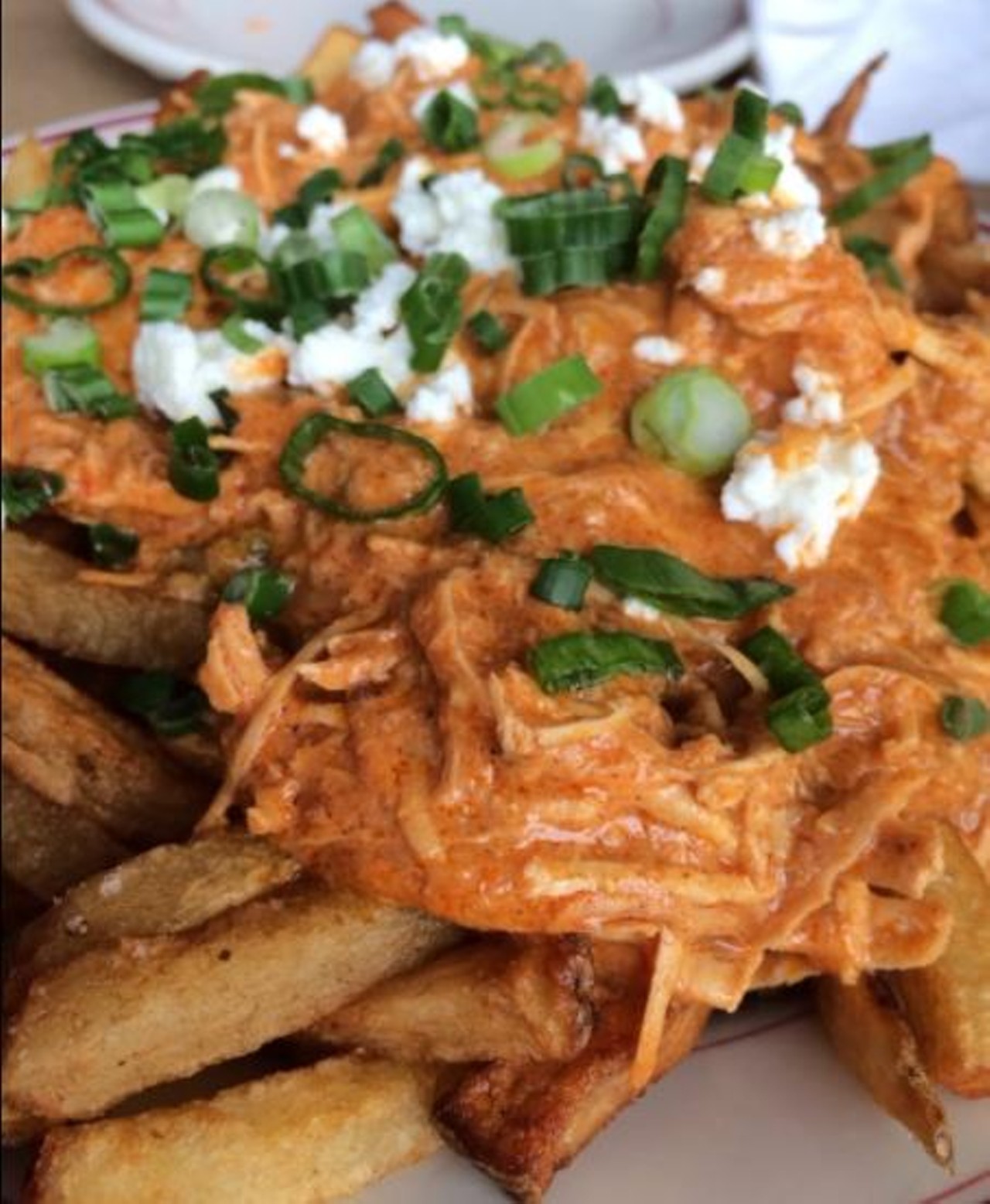 What to Order - Tikka Fries 
This radical spin on Coney fries includes hand cut fries topped with chicken tikka masala, house made paneer and chopped scallions. A fan favorite!
Photo via Mi L. 