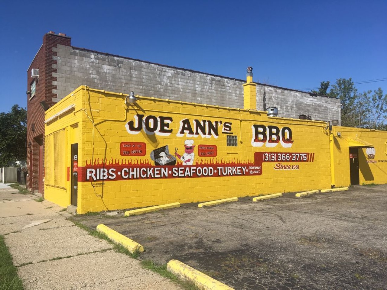 Joe Ann's
3139 Jerome St, Detroit; 313-366-3775
Joe Ann's is one of the longest-running barbecue operations in Detroit (if not the longest-running), first serving up its delicious 'cue 65 years ago. If you go to Joe Ann's bright yellow building that's decorated with a picture of a grillin' pig and a proclamation that the restaurant is the castle of Detroit's "BBQ Queen." The best place to start here is the chicken. The BBQ Queen knows her bird, which is moist and falls off the bone in a manner that isn't common in Detroit's barbecue joints.
Photo by Lee DeVito