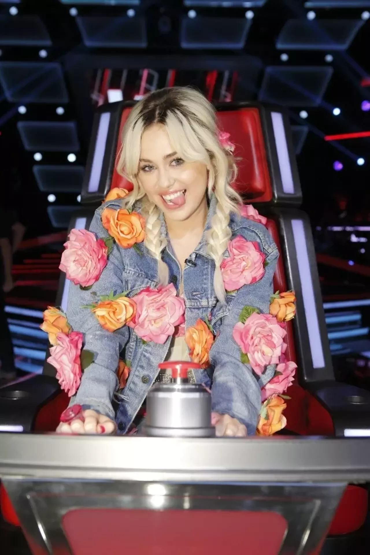 To achieve this crazy Miley Cyrus costume you habve to get a little crafty. Glue some fake flowers onto a pair of jeans, a jean jacket, and a pink leotard. Photo courtesy of Fox 