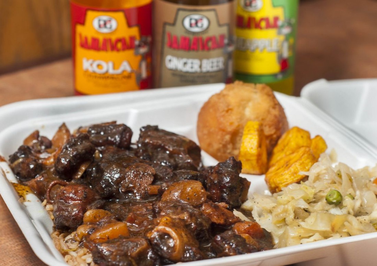 Oxtail, festival bread, and cabbage from Jamaica Jamaica.